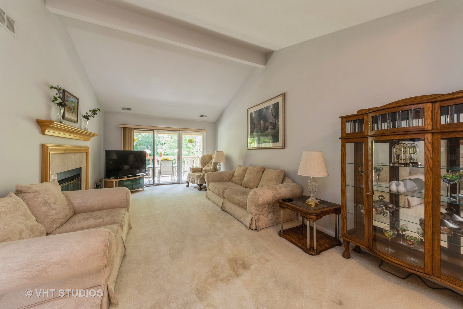 1857 Ashbury Lane, Unit 36 Inverness, IL 60067 - Photo 3 of 20 a living room with furniture and a flat screen tv