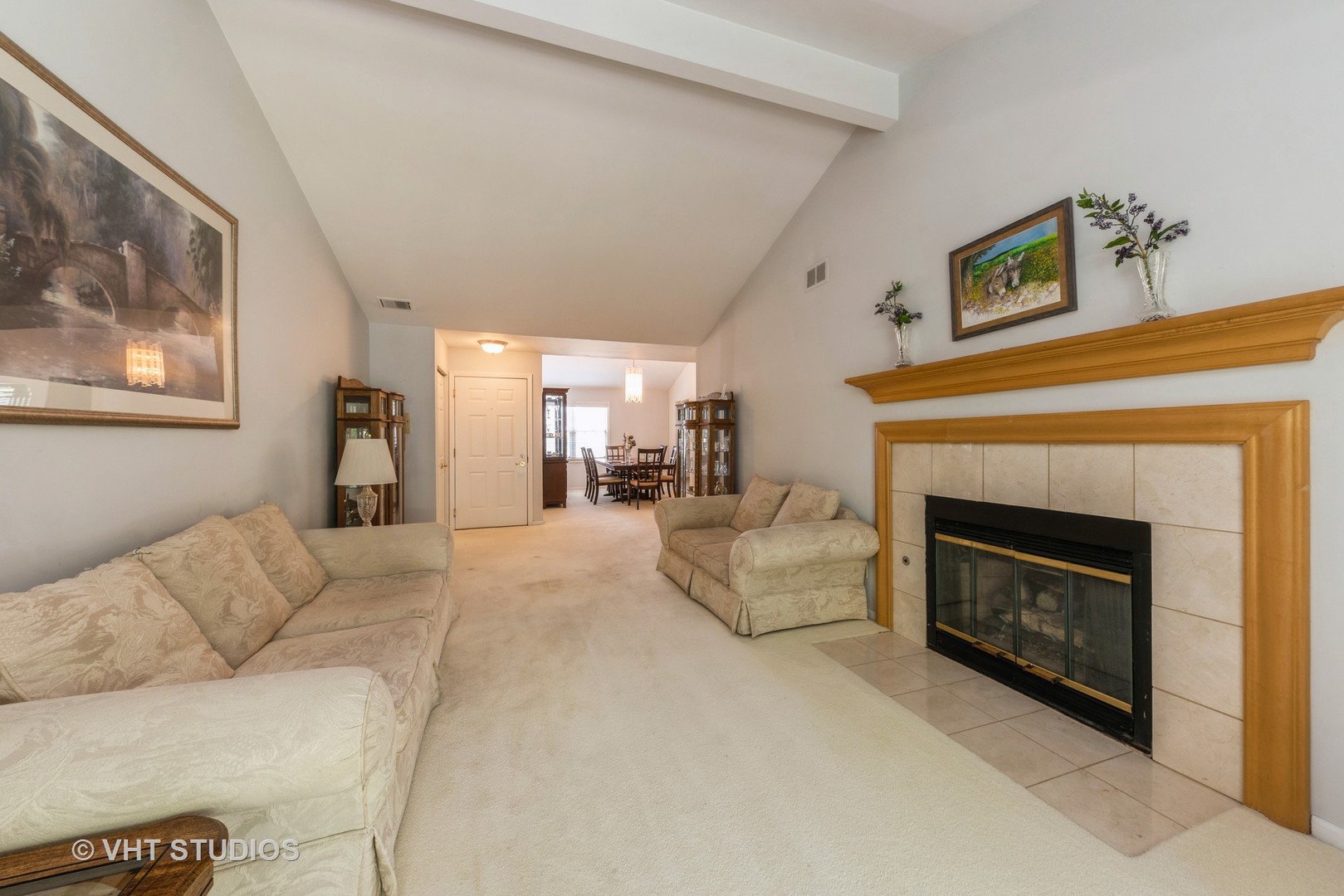 1857 Ashbury Lane, Unit 36 Inverness, IL 60067 - Photo 4 of 20 a living room with furniture and a fireplace