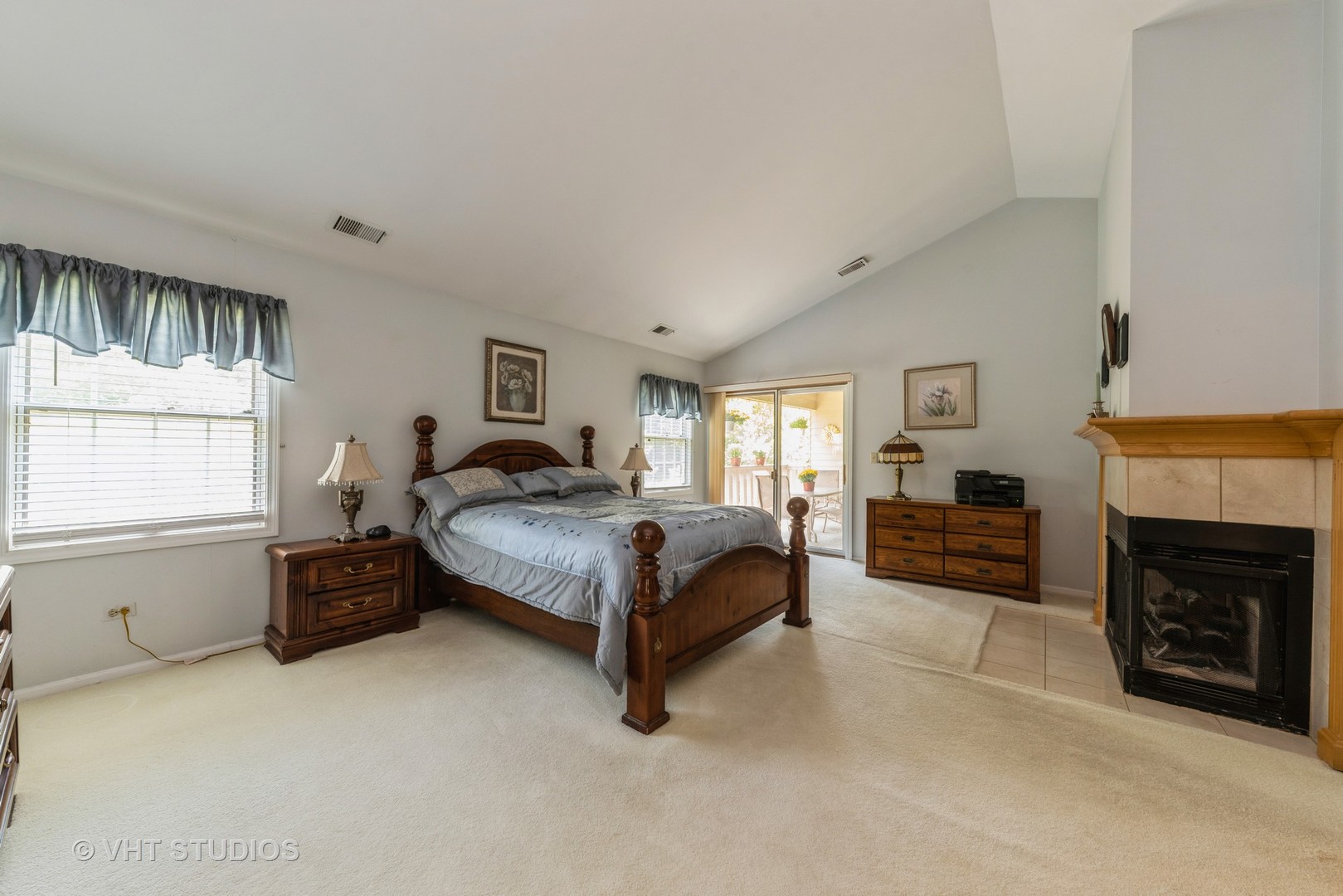 1857 Ashbury Lane, Unit 36 Inverness, IL 60067 - Photo 9 of 20 a spacious bedroom with a bed a fireplace and a large window