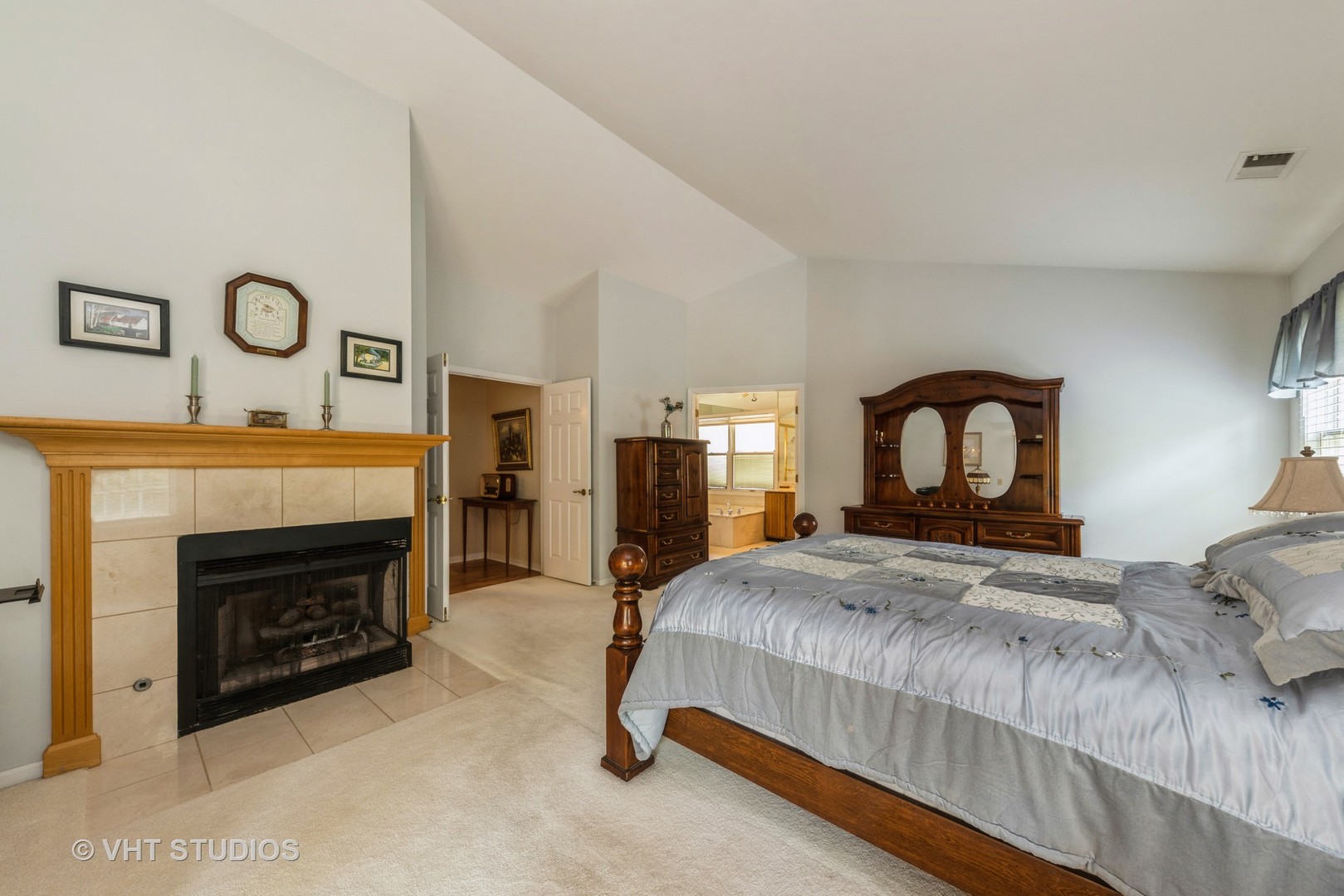 1857 Ashbury Lane, Unit 36 Inverness, IL 60067 - Photo 10 of 20 a bedroom with a bed and a fireplace