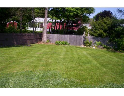 35 Anna Road Woburn, MA 01801 - Photo 3 of 3 a backyard of a house with lots of green space