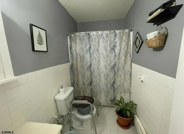 a bathroom with a toilet and a sink