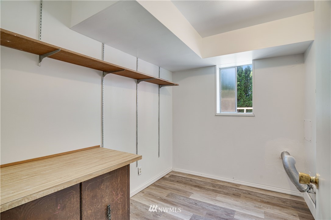 3107 Southeast 18th Street Renton, WA 98058 - Photo 22 of 32 a room with a table and wooden floor