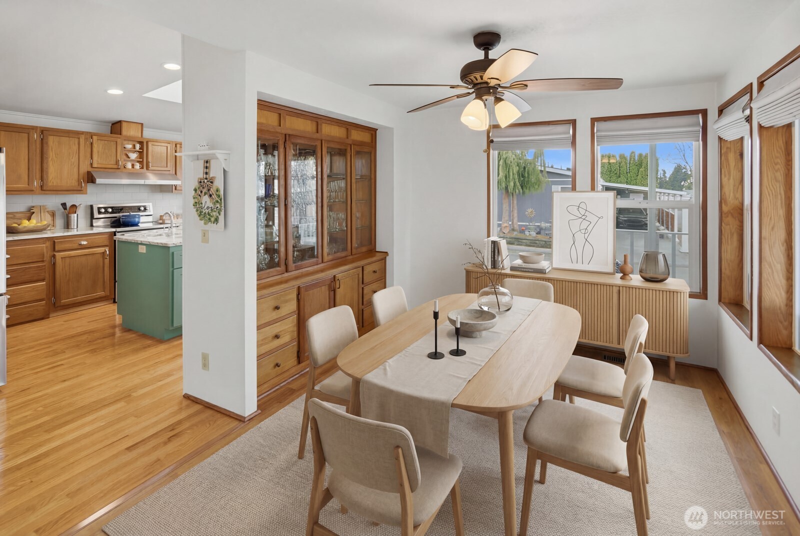 1427 100th Street Southwest, Unit 149 Everett, WA 98204 - Photo 13 of 40 a view of a dining room with furniture window and wooden floor