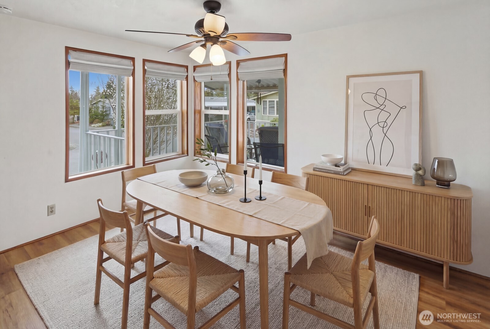 1427 100th Street Southwest, Unit 149 Everett, WA 98204 - Photo 14 of 40 a view of a dining room with furniture wooden floor and chandelier