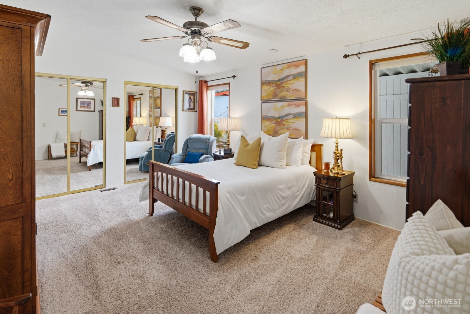 1427 100th Street Southwest, Unit 149 Everett, WA 98204 - Photo 15 of 40 a spacious bedroom with a bed couch and a window