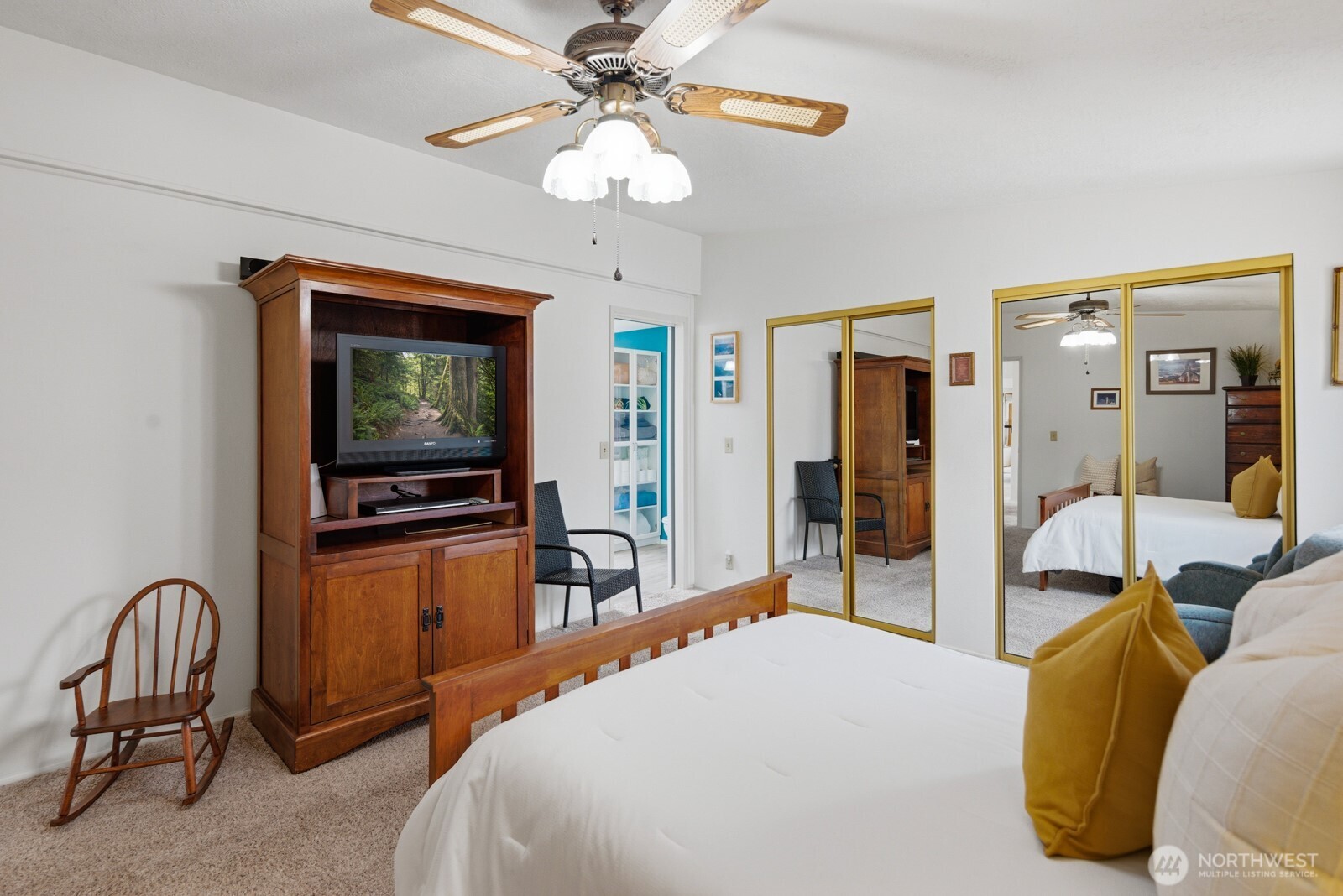 1427 100th Street Southwest, Unit 149 Everett, WA 98204 - Photo 17 of 40 a bedroom with a bed and a flat screen tv
