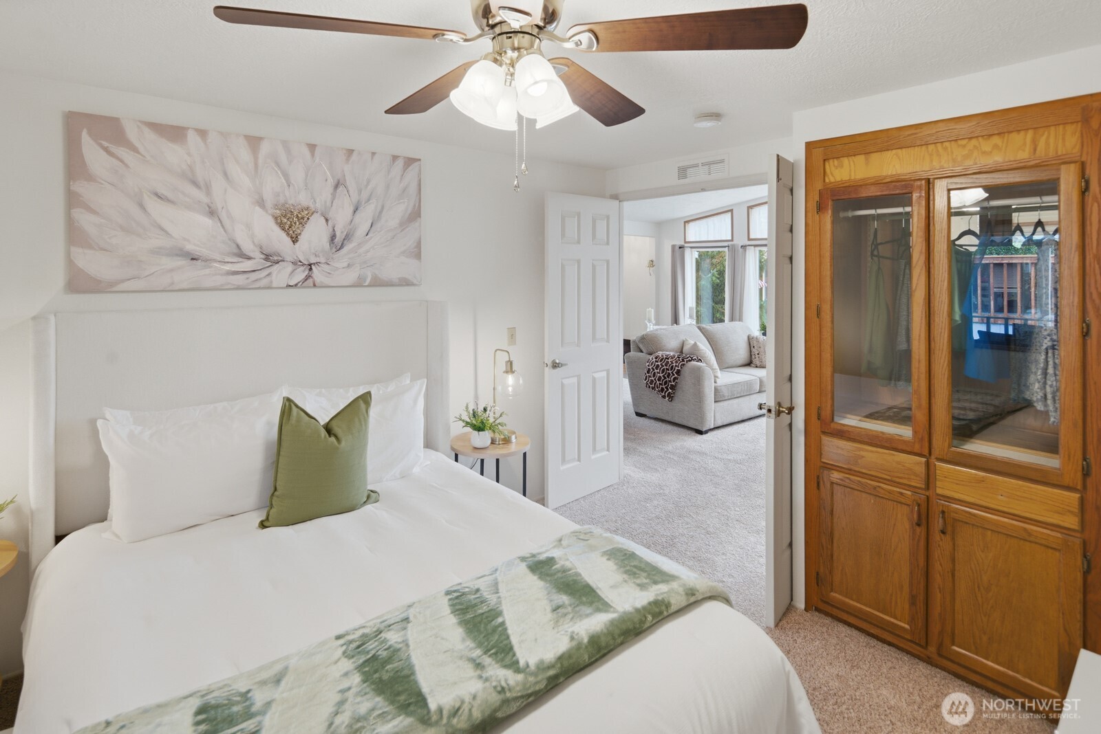 1427 100th Street Southwest, Unit 149 Everett, WA 98204 - Photo 23 of 40 a bedroom with a bed and ceiling fan