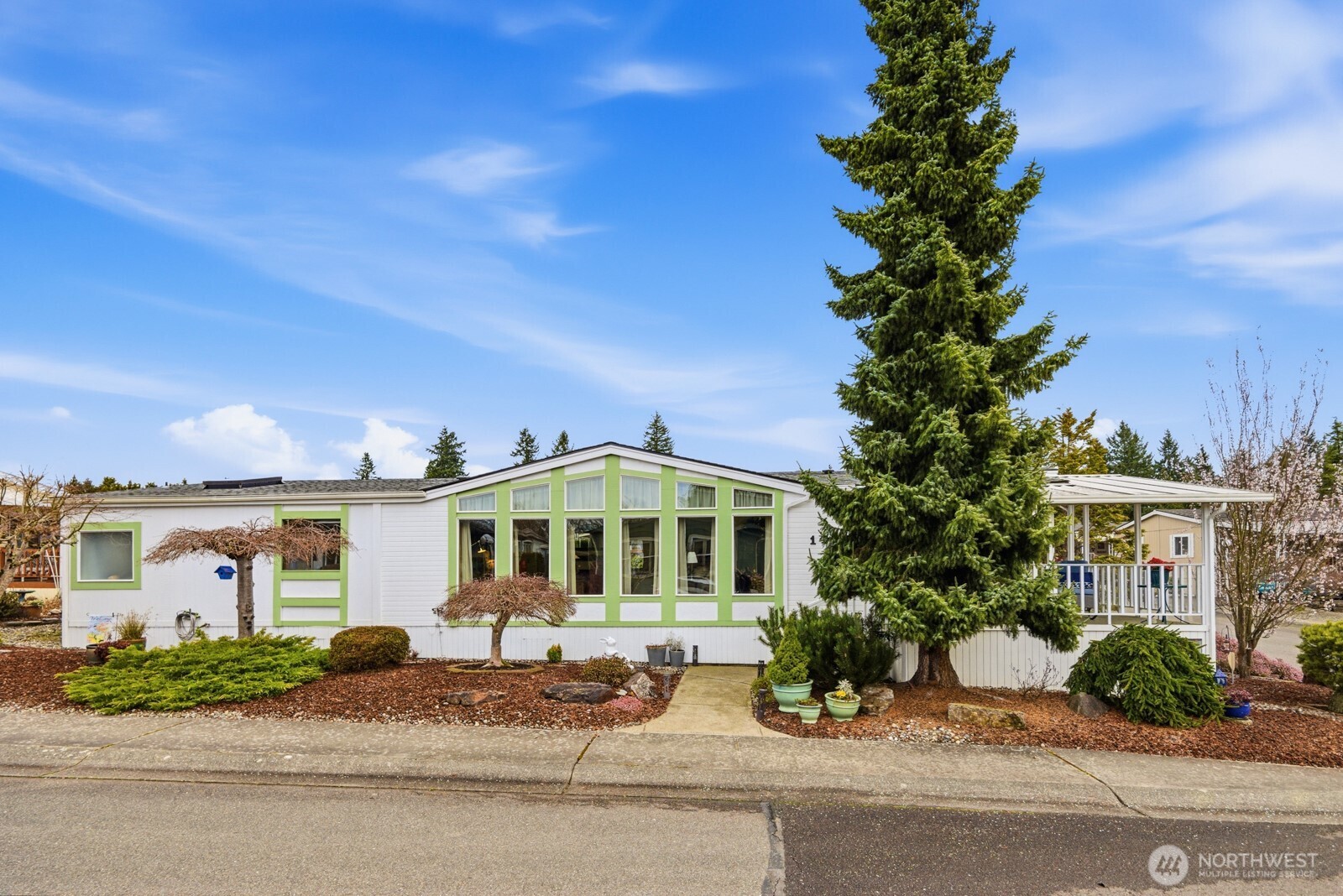 1427 100th Street Southwest, Unit 149 Everett, WA 98204 - Photo 32 of 40 front view of a house with a yard