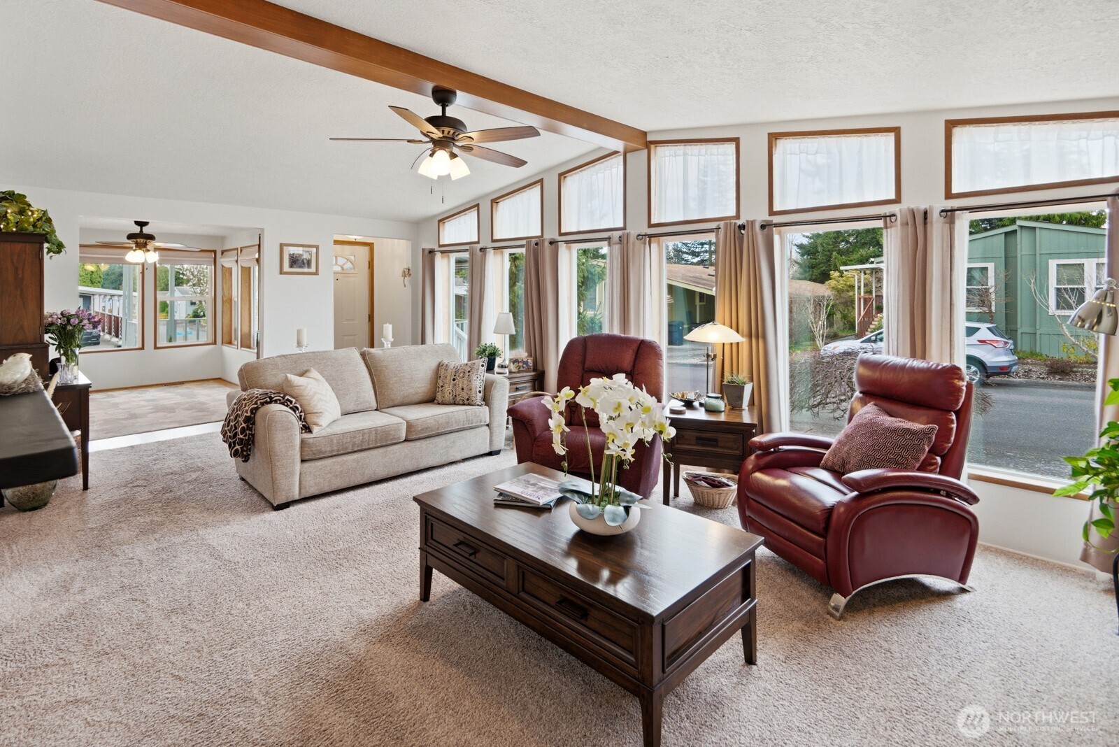 1427 100th Street Southwest, Unit 149 Everett, WA 98204 - Photo 4 of 40 a living room with furniture a large window and a chandelier