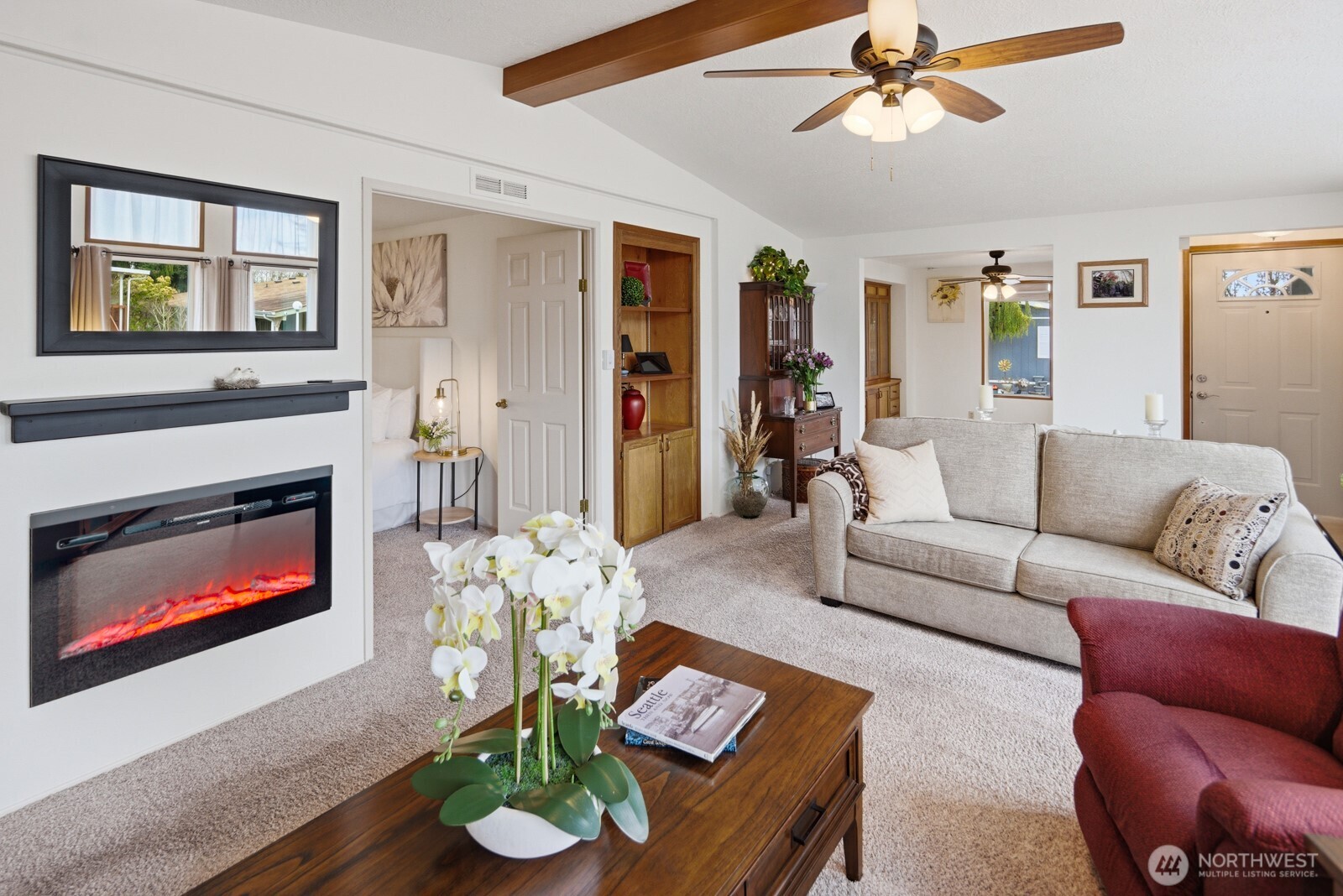 1427 100th Street Southwest, Unit 149 Everett, WA 98204 - Photo 6 of 40 a living room with furniture a fireplace and a window