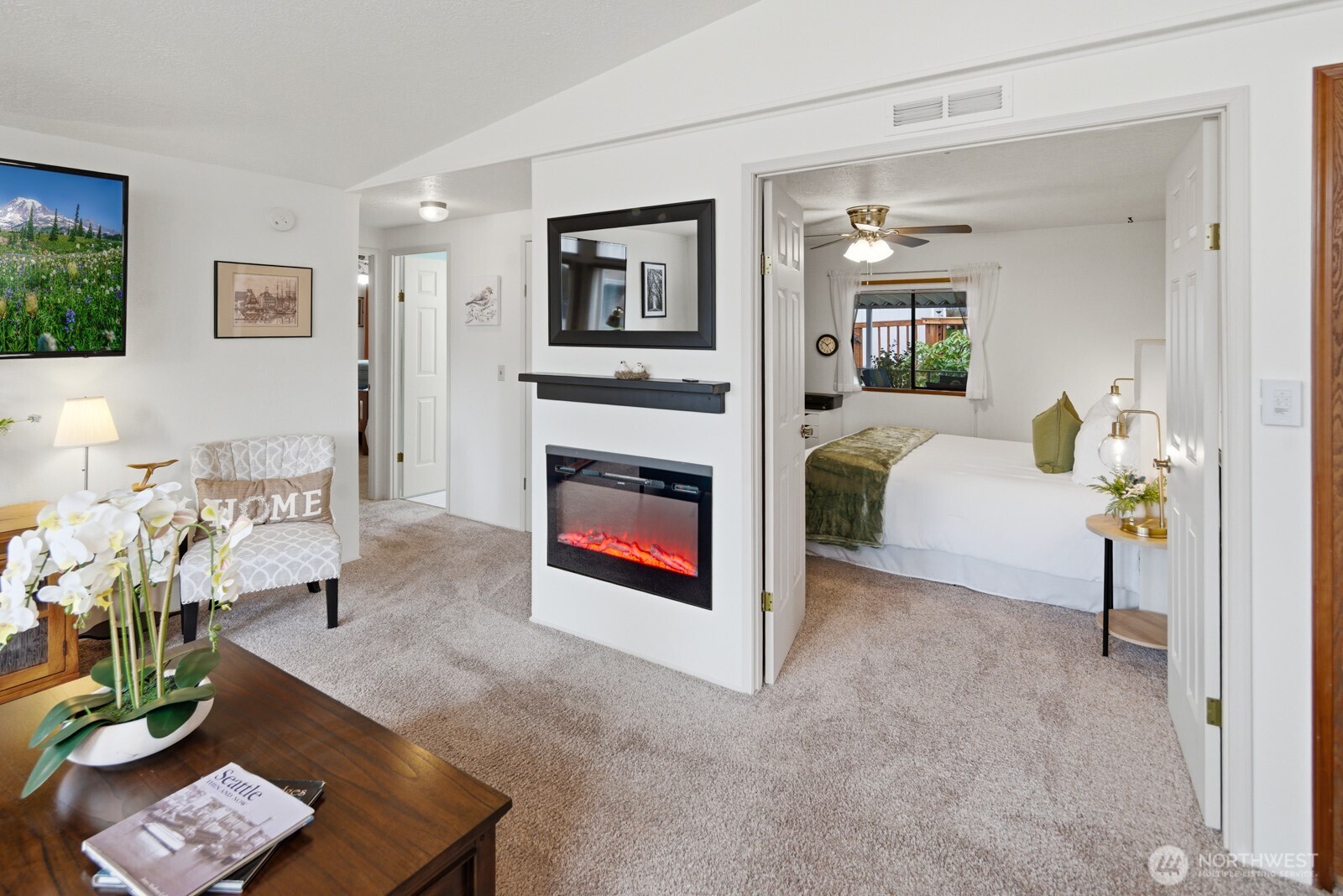 1427 100th Street Southwest, Unit 149 Everett, WA 98204 - Photo 7 of 40 a living room with furniture and a fireplace