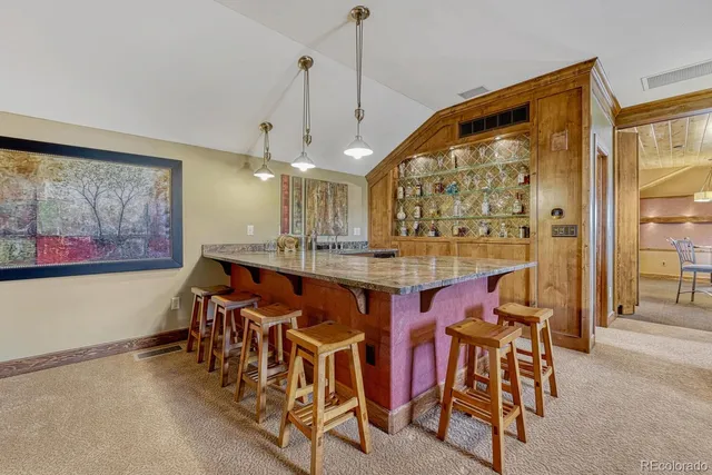 a view of a dining room with furniture and window