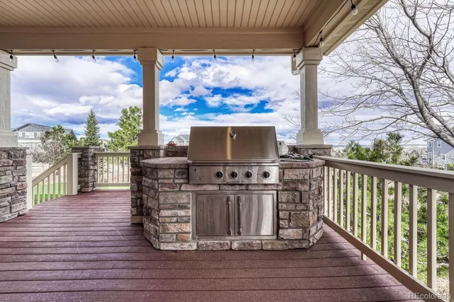 a view of a balcony with wooden floor