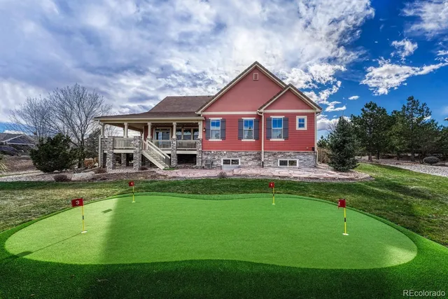 a view of house with a yard