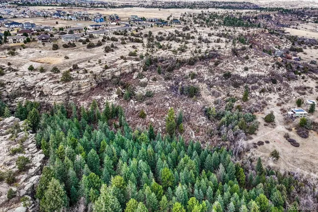 a picture of a bench in front of a building
