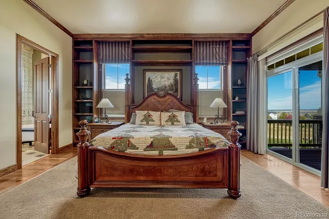 a bed sitting in a room next to a window