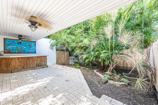 a white toilet sitting next to a white sink