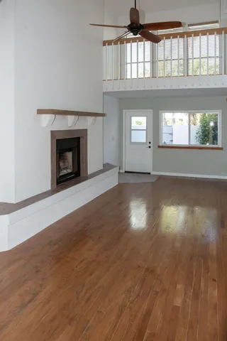 a bathroom with a tub a sink and mirror
