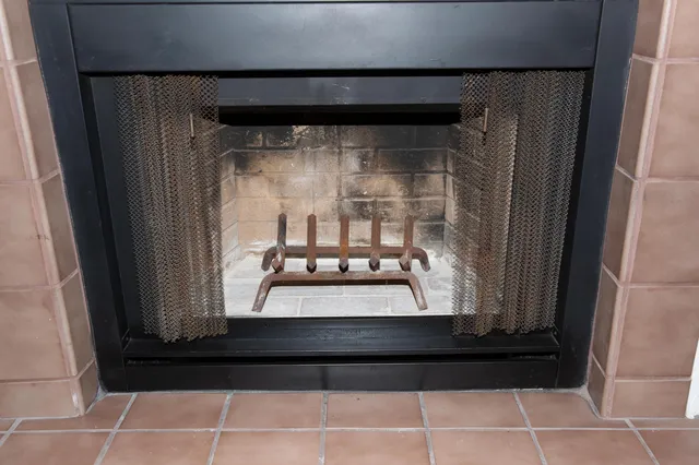 a bathroom with a granite countertop sink a toilet a shower and a mirror