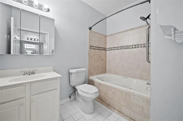 a bathroom with a sink a toilet and a bathtub