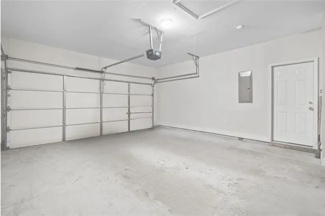 a backyard of a house with plants and trees