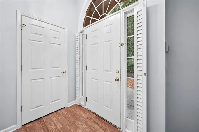 a view of an entryway with wooden floor