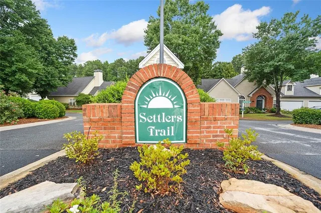 a sign that is next to a road