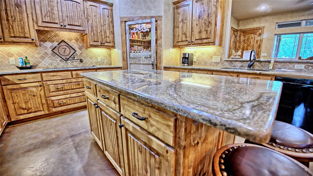 4509 Lazy E Road St. Jo, TX 76265 - Photo 3 of 39 a view of a kitchen with sink and dishwasher