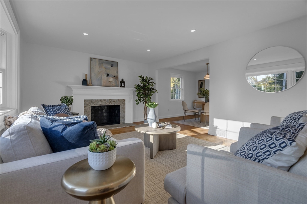 67 Cushing Road Westwood, MA 02090 - Photo 14 of 41 a living room with furniture a fireplace and a potted plant