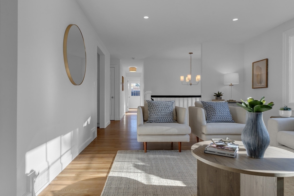 67 Cushing Road Westwood, MA 02090 - Photo 18 of 41 a living room with furniture and a potted plant