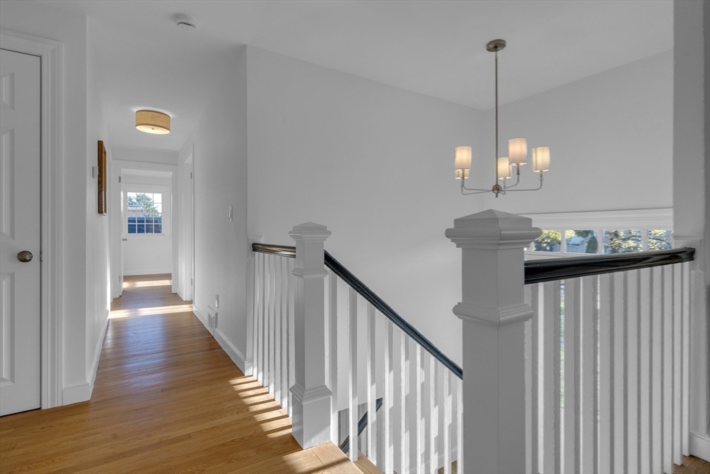 67 Cushing Road Westwood, MA 02090 - Photo 19 of 41 a view of a hallway with windows