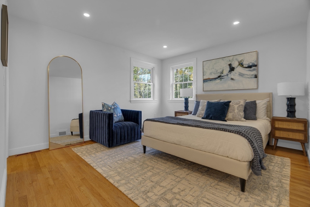 67 Cushing Road Westwood, MA 02090 - Photo 21 of 41 a spacious bedroom with a bed and a couch