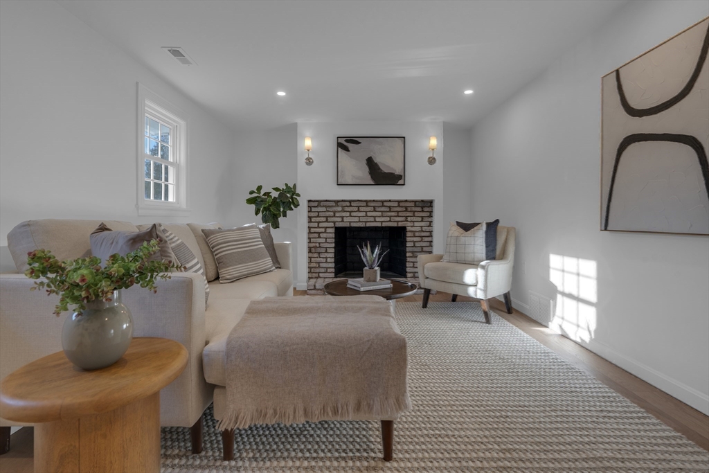 67 Cushing Road Westwood, MA 02090 - Photo 28 of 41 a living room with furniture and a fireplace
