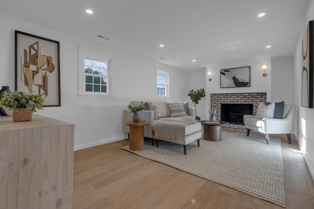 67 Cushing Road Westwood, MA 02090 - Photo 30 of 41 a living room with furniture and a fireplace