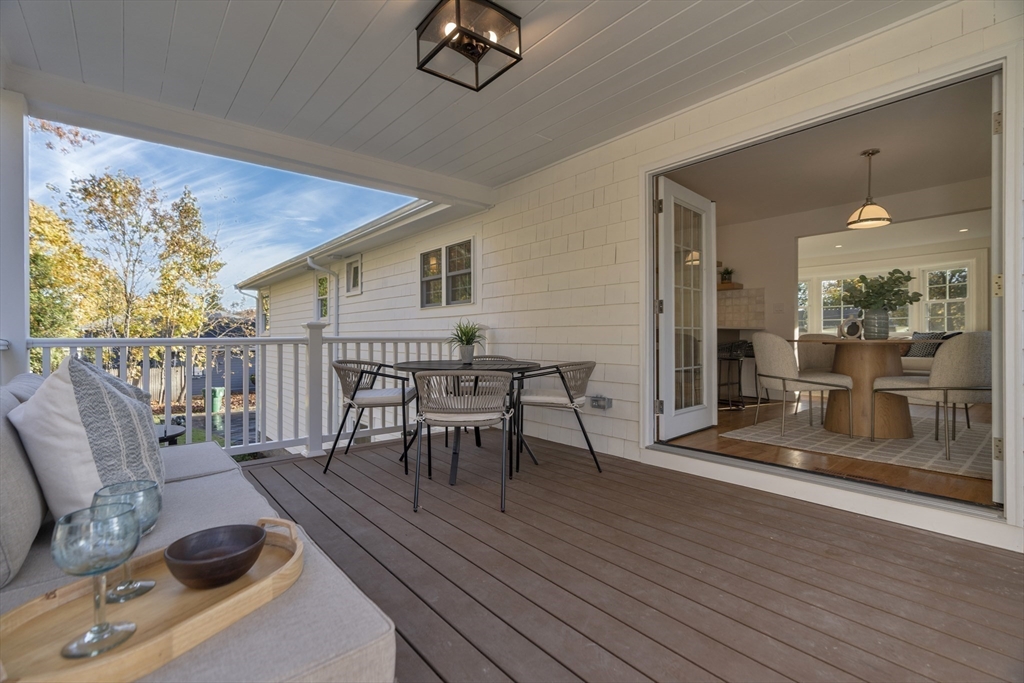 67 Cushing Road Westwood, MA 02090 - Photo 37 of 41 a living room with furniture a wooden floor and a table