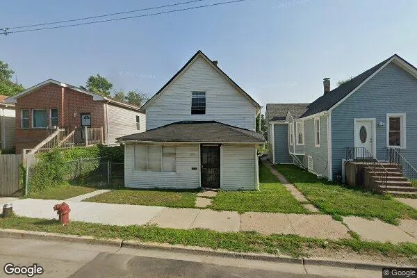 a front view of a house with a garden and plants