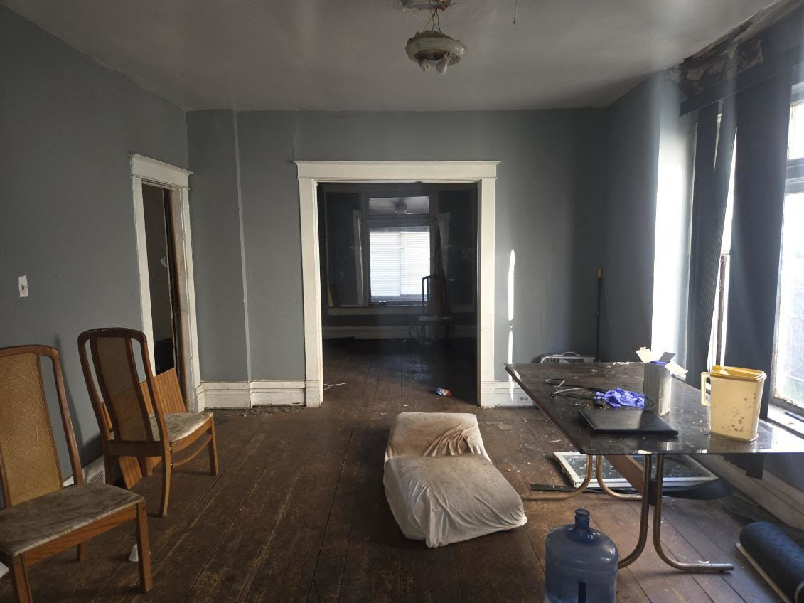 433 West 103rd Street Chicago, IL 60628 - Photo 5 of 11 a living room with furniture and wooden floor