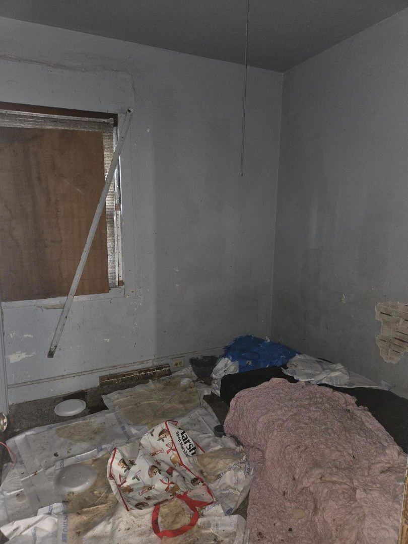 433 West 103rd Street Chicago, IL 60628 - Photo 7 of 11 a bedroom with a bed and a dresser