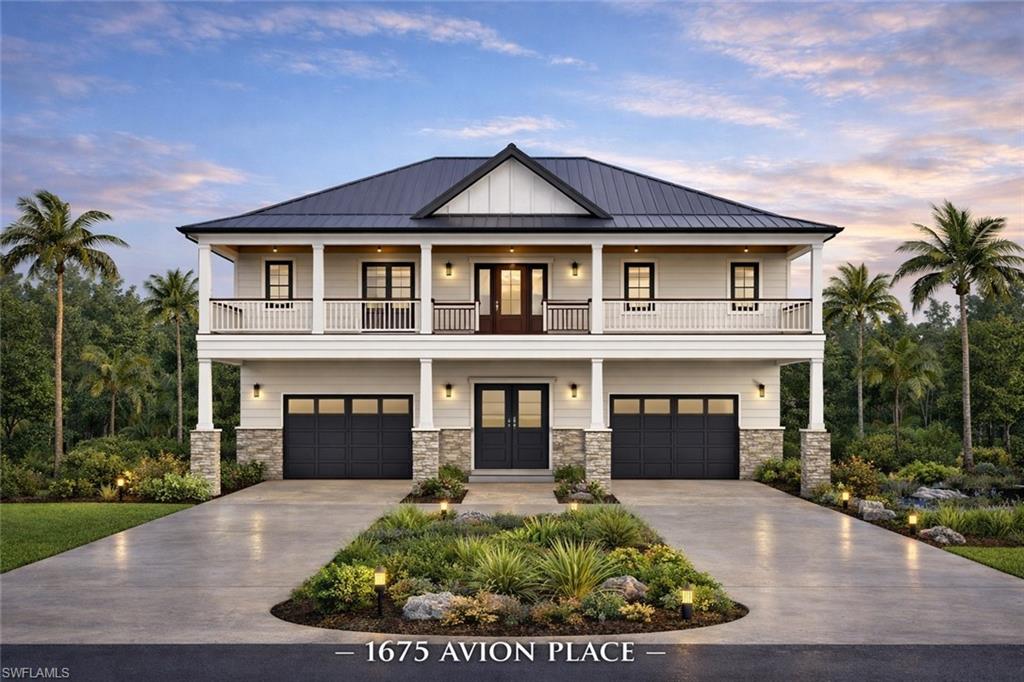 a front view of a house with a garden and garage