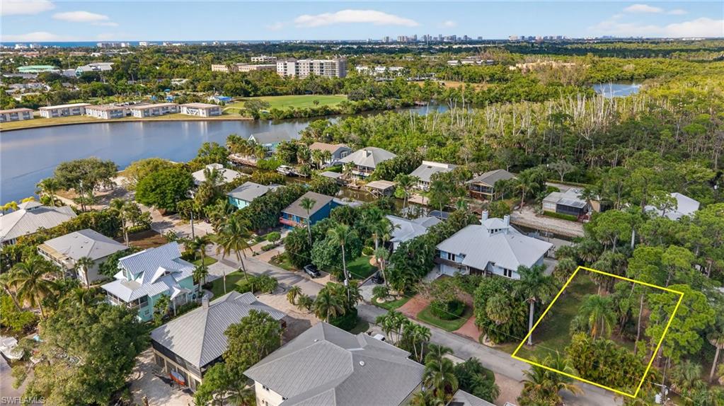 1675 Avion Place Naples, FL 34104 - Photo 12 of 16 an aerial view of residential houses with outdoor space and river
