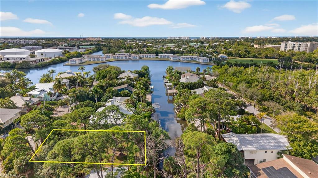 1675 Avion Place Naples, FL 34104 - Photo 13 of 16 an aerial view of a residential houses with outdoor space and river view