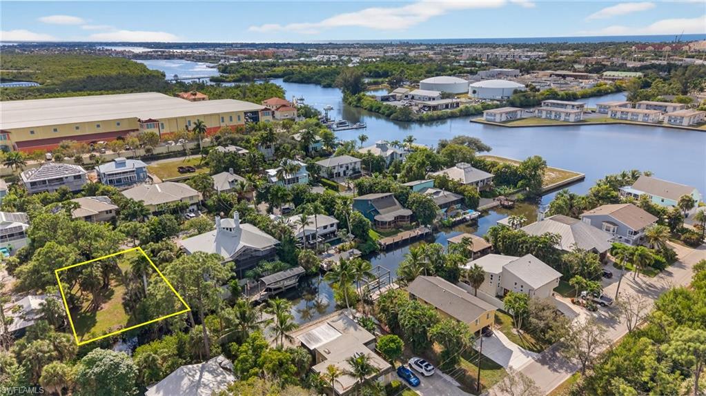 1675 Avion Place Naples, FL 34104 - Photo 14 of 16 an aerial view of residential houses with outdoor space