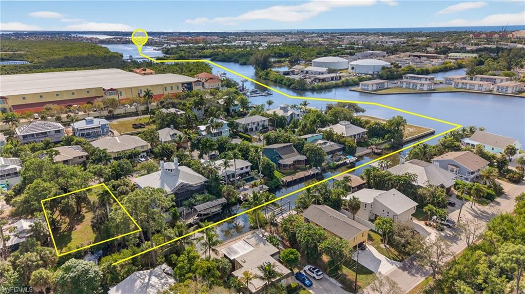 1675 Avion Place Naples, FL 34104 - Photo 16 of 21 an aerial view of residential houses with outdoor space