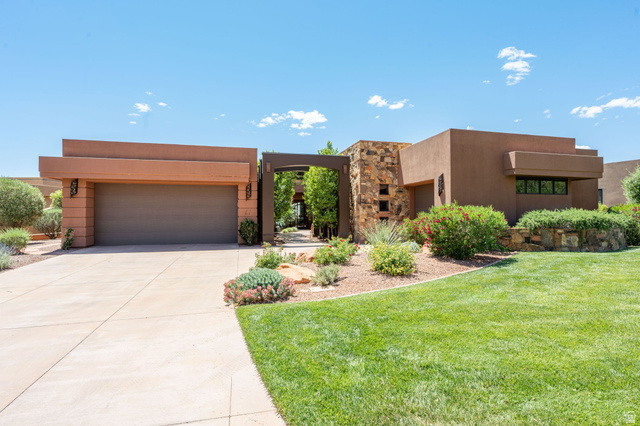2331 West Entrada Trail, Unit 61 St. George, UT 84770 - Photo 2 of 69 Contemporary stucco exterior with stacked stone accents