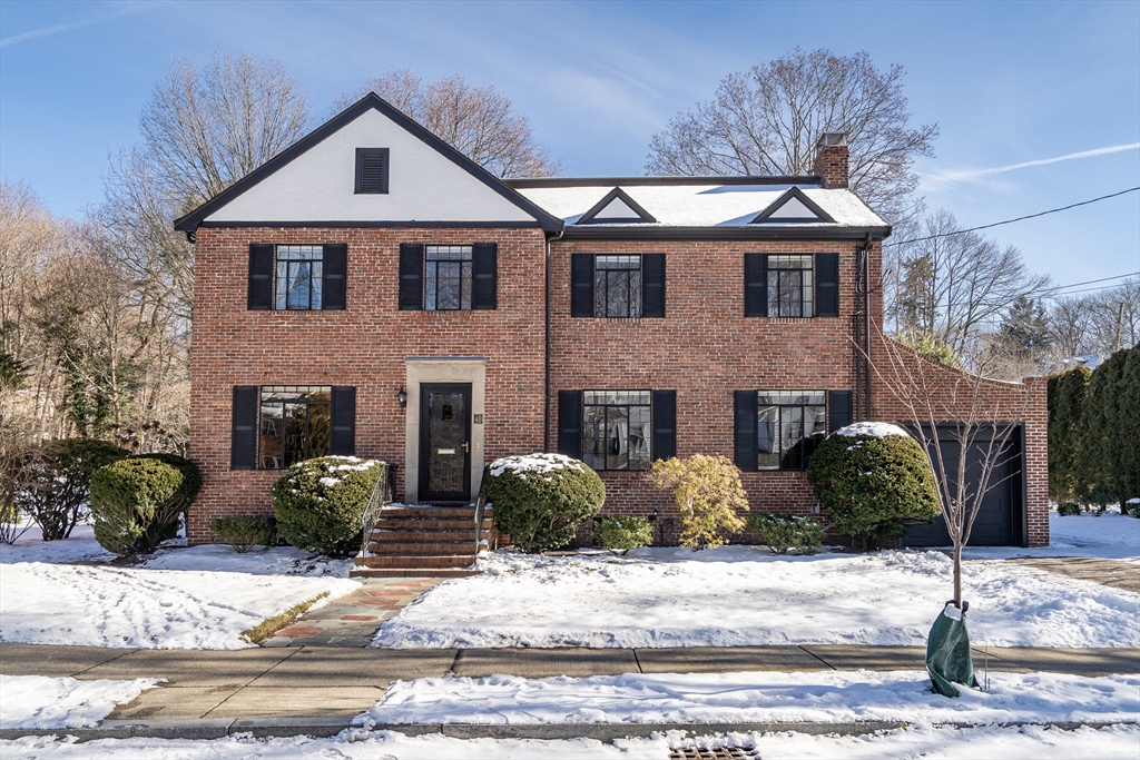 48 Avondale Road Newton, MA 02459 - Photo 1 of 37 a front view of a house with garden and plants