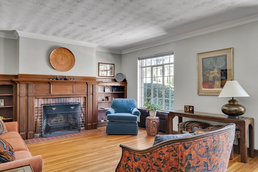 48 Avondale Road Newton, MA 02459 - Photo 21 of 37 a living room with furniture a window and a fireplace