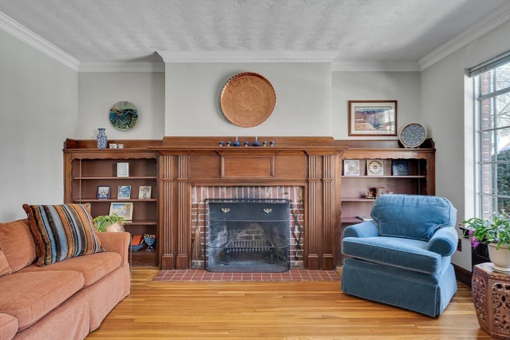 48 Avondale Road Newton, MA 02459 - Photo 23 of 37 a living room with furniture and a fireplace