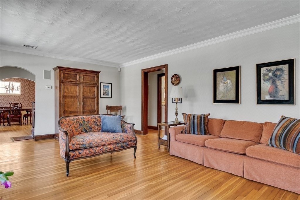 48 Avondale Road Newton, MA 02459 - Photo 24 of 37 a living room with furniture and a wooden floor