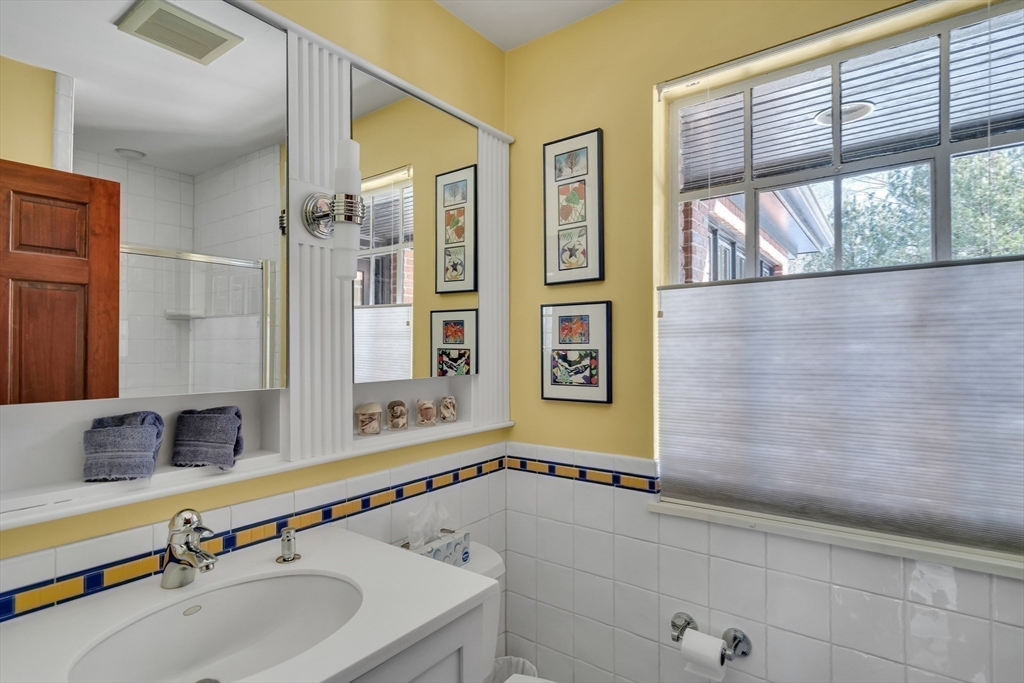 48 Avondale Road Newton, MA 02459 - Photo 27 of 37 a bathroom with a sink and a mirror